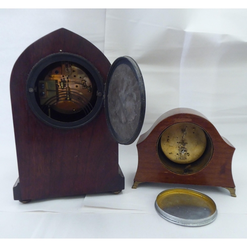 244 - Ten dissimilar early/mid 20thC clocks: to include an Edwardian string inlaid mahogany cased example ... 