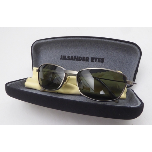 246 - A pair of lady's Calvin Klein 341s tortoiseshell rimmed sunglasses  cased; and a pair of Jil Sander ... 