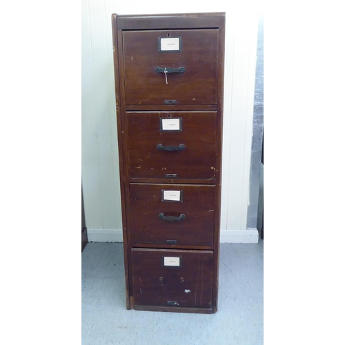 297 - A mid 20thC mahogany four drawer filing cabinet, on a plinth  52