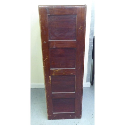 297 - A mid 20thC mahogany four drawer filing cabinet, on a plinth  52