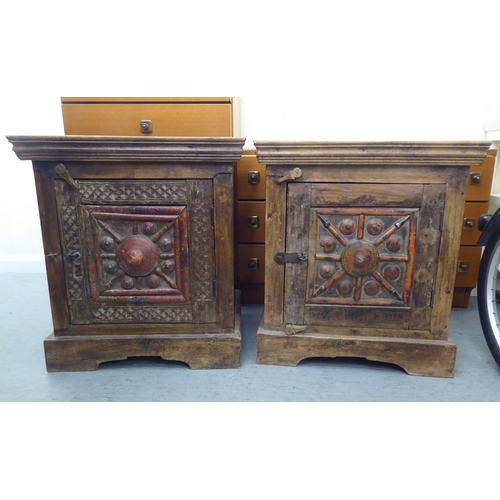 301 - Two similar rustically constructed hardwood single drawer bedside chests, on a bracket plinth  ... 