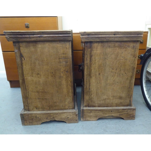 301 - Two similar rustically constructed hardwood single drawer bedside chests, on a bracket plinth  ... 