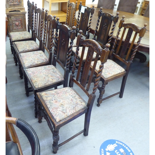 305 - Mainly early 20thC oak chairs: to include one with barleytwist uprights and a drop-in seat