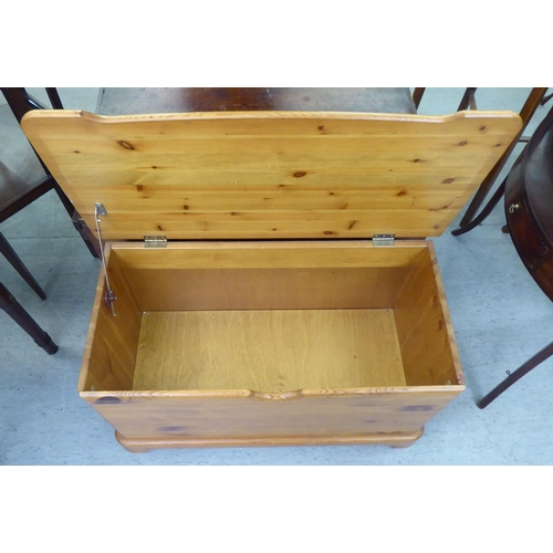 307 - A modern pine chest with straight sides and a hinged lid, on a plinth&nbsp; 17