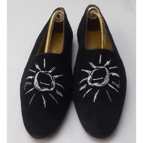 31 - A pair of ladies Hermes black suede pumps with stitched sun motifs  size 38.5 with a an orange dust ... 