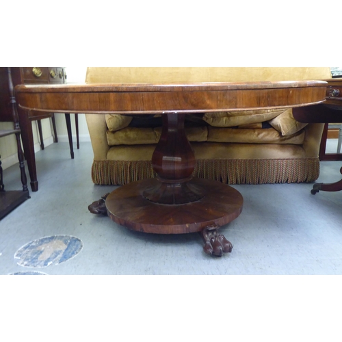 313 - A William IV rosewood pedestal centre table, on a bulbous column, a circular plinth and lion paw fee... 