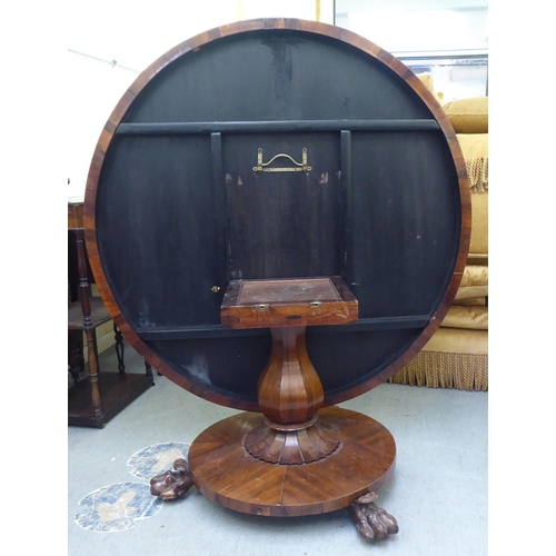 313 - A William IV rosewood pedestal centre table, on a bulbous column, a circular plinth and lion paw fee... 