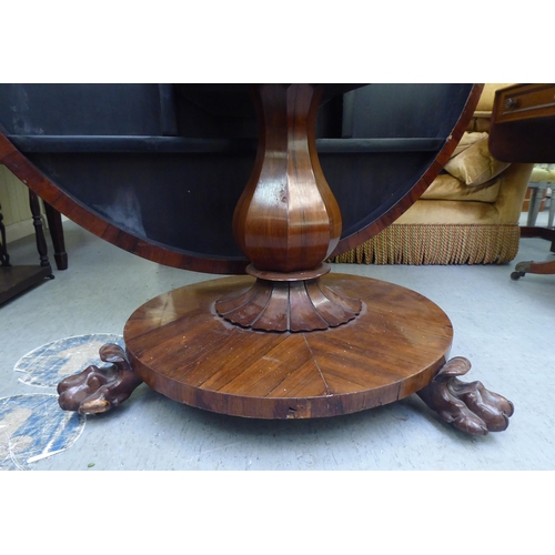 313 - A William IV rosewood pedestal centre table, on a bulbous column, a circular plinth and lion paw fee... 