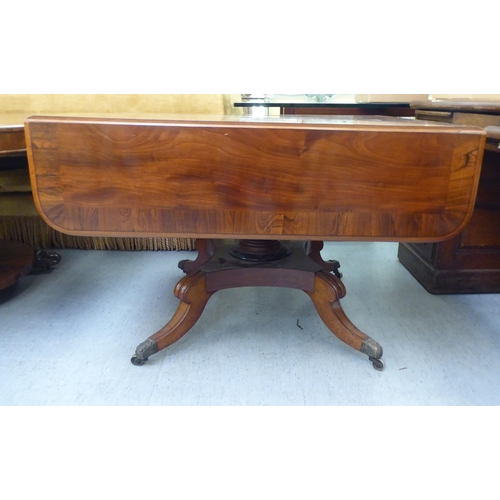 314 - A Victorian crossbanded rosewood and mahogany sofa table with two pairs of frieze drawers, raised on... 