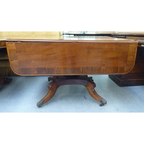 314 - A Victorian crossbanded rosewood and mahogany sofa table with two pairs of frieze drawers, raised on... 
