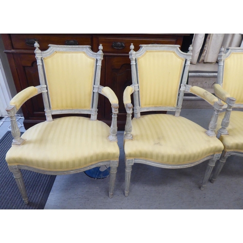 315 - A set of four mid 20thC French inspired shabby chic showwood framed open arm salon chairs with two t... 