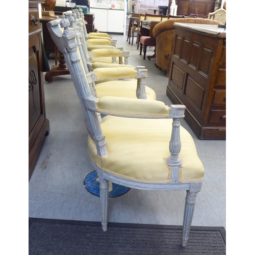 315 - A set of four mid 20thC French inspired shabby chic showwood framed open arm salon chairs with two t... 