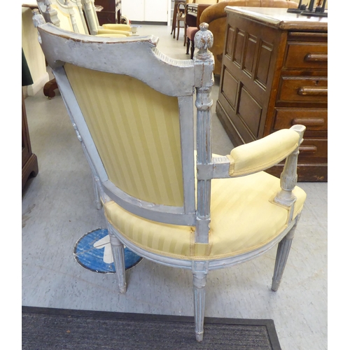 315 - A set of four mid 20thC French inspired shabby chic showwood framed open arm salon chairs with two t... 