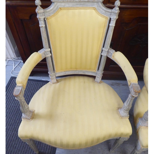 315 - A set of four mid 20thC French inspired shabby chic showwood framed open arm salon chairs with two t... 