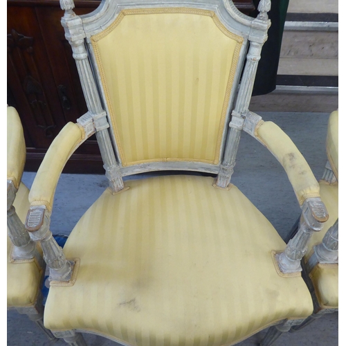 315 - A set of four mid 20thC French inspired shabby chic showwood framed open arm salon chairs with two t... 