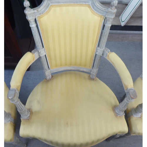 315 - A set of four mid 20thC French inspired shabby chic showwood framed open arm salon chairs with two t... 