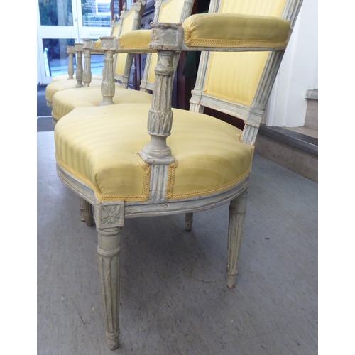 315 - A set of four mid 20thC French inspired shabby chic showwood framed open arm salon chairs with two t... 