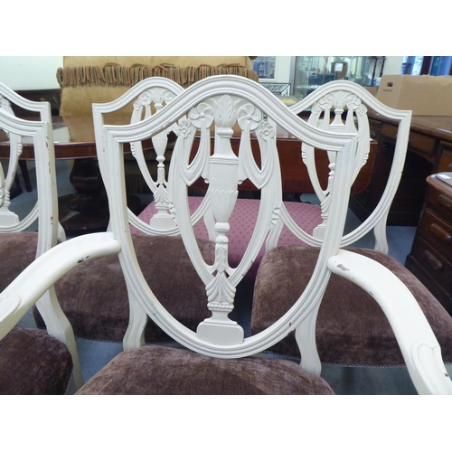 317 - A set of seven Edwardian Sheraton Revival inspired cream coloured painted shield and pierced vase de... 