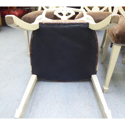 317 - A set of seven Edwardian Sheraton Revival inspired cream coloured painted shield and pierced vase de... 