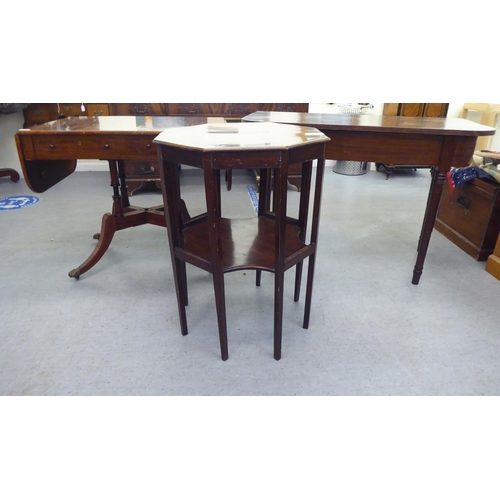 321 - 19thC and later furniture: to include a Regency reproduction of a mahogany sofa table, raised on spl... 