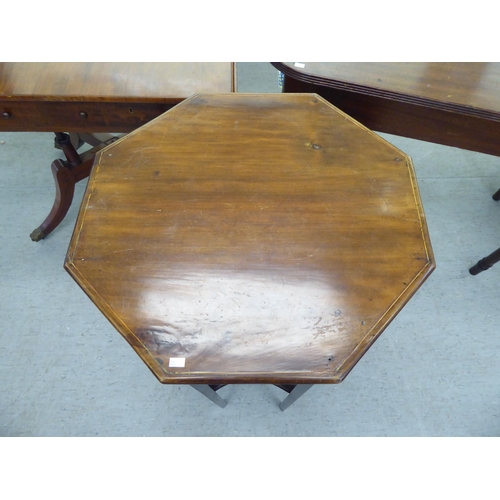 321 - 19thC and later furniture: to include a Regency reproduction of a mahogany sofa table, raised on spl... 