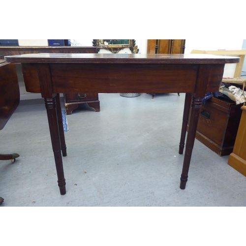 321 - 19thC and later furniture: to include a Regency reproduction of a mahogany sofa table, raised on spl... 
