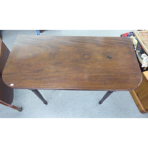 321 - 19thC and later furniture: to include a Regency reproduction of a mahogany sofa table, raised on spl... 