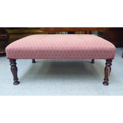 325 - An early 20thC and later fabric upholstered, cushioned top footstool, raised on turned mahogany legs... 