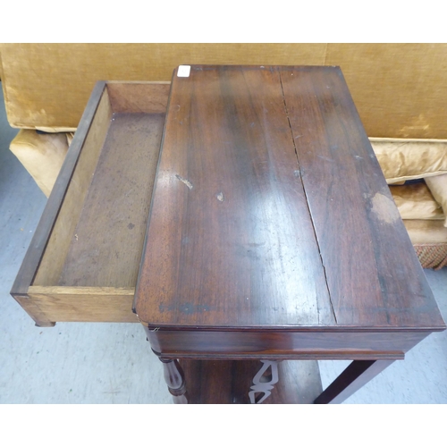 326 - A late 19thC rosewood three tier what-not, raised on turned column supports&nbsp; 38