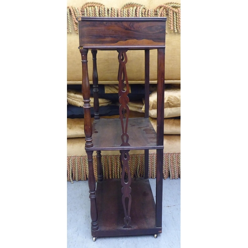 326 - A late 19thC rosewood three tier what-not, raised on turned column supports&nbsp; 38