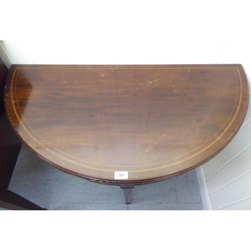 327 - An Edwardian Georgian style string inlaid mahogany demi-lune card table, raised on square, tapered l... 