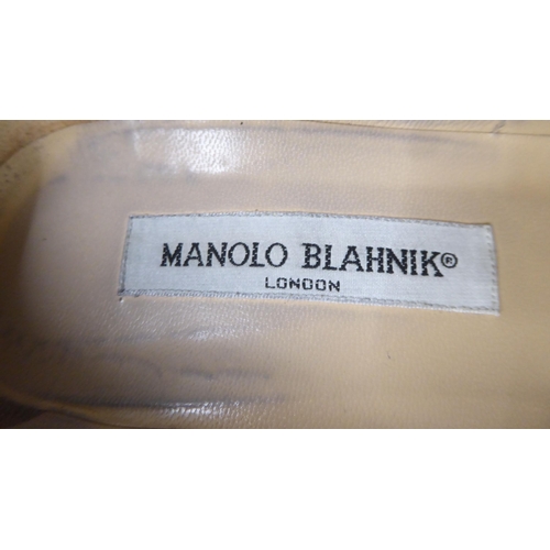 33 - A pair of ladies Manolo Blahnik black fabric, heeled shoes  size 39 with a dust bag