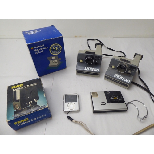 331 - Photographic equipment: to include 'The Button' polaroid land camera; and a Sigma Super 70 camera&nb... 
