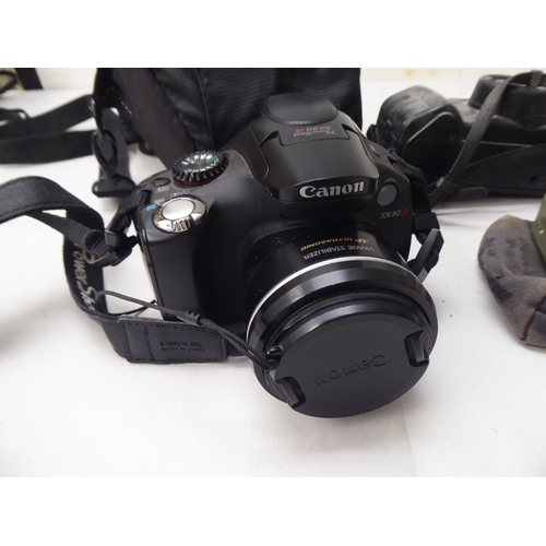 331 - Photographic equipment: to include 'The Button' polaroid land camera; and a Sigma Super 70 camera&nb... 