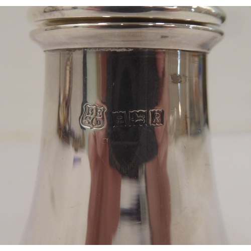 334 - A silver plated caster; another in silver; and a pair of silver sugar tongs  mixed marks