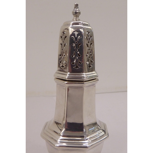 334 - A silver plated caster; another in silver; and a pair of silver sugar tongs  mixed marks