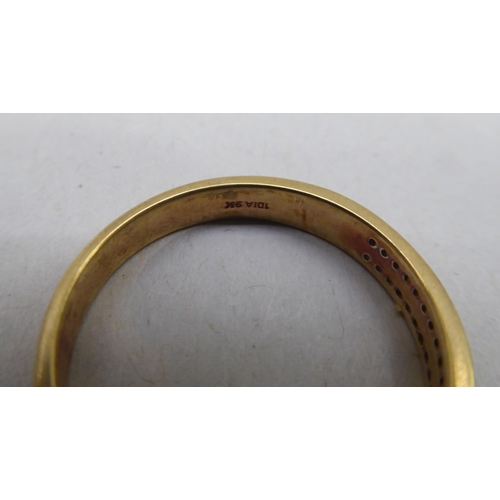 336 - A gold coloured metal ring, set with two rows of diamonds