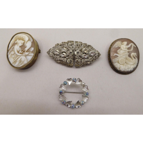 338 - Two cameo brooches; a circular brooch; and a clasp brooch