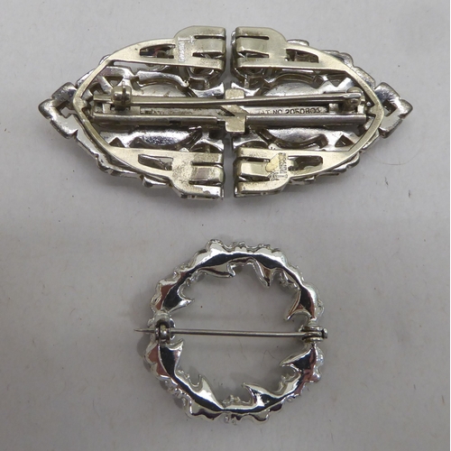 338 - Two cameo brooches; a circular brooch; and a clasp brooch