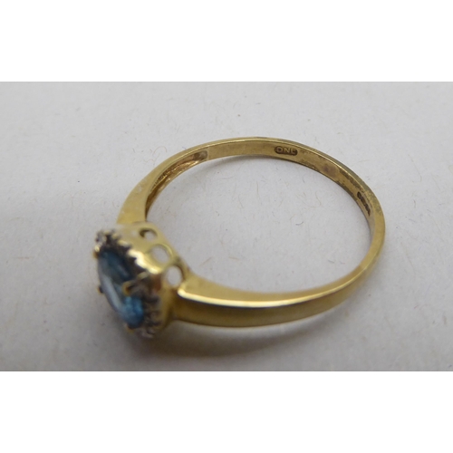 339 - A 9ct gold blue topaz and diamond set cluster ring