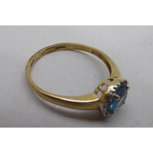 339 - A 9ct gold blue topaz and diamond set cluster ring