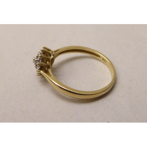 340 - A 9ct gold diamond cluster ring