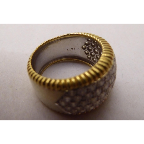 344 - An 18ct bi-coloured diamond pave set band ring