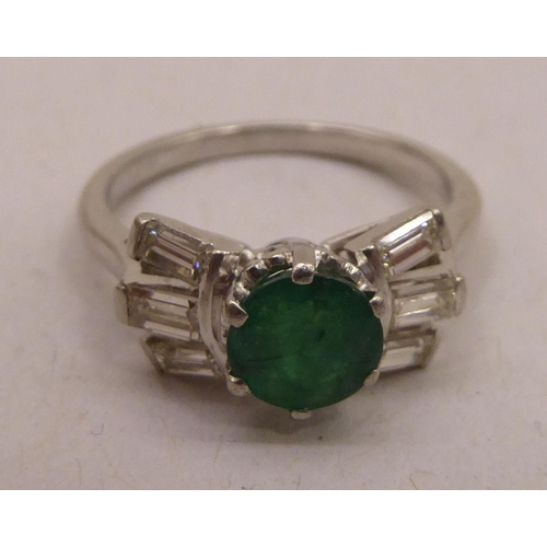 345 - An Art Deco inspired platinum, emerald and baguette cut diamond ring