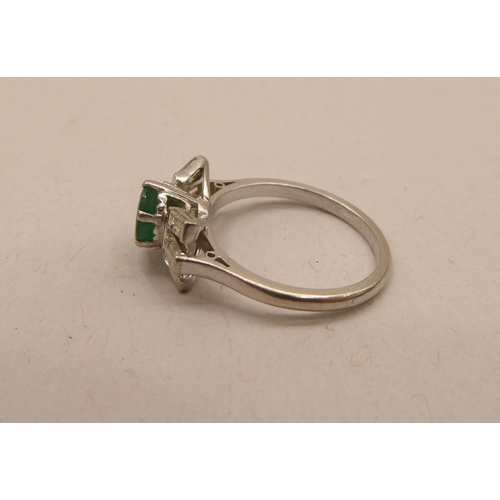 345 - An Art Deco inspired platinum, emerald and baguette cut diamond ring