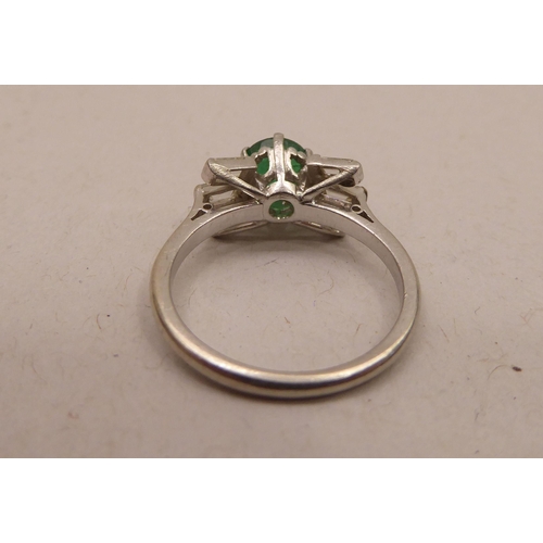 345 - An Art Deco inspired platinum, emerald and baguette cut diamond ring