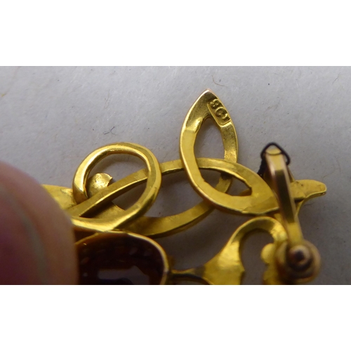 347 - A 9ct gold Art Nouveau inspired pendant, set with two citrines