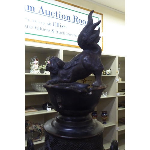 351 - A Japanese bronze finished, metal temple censer with a pagoda top, over a pierced bowl, on a pedesta... 