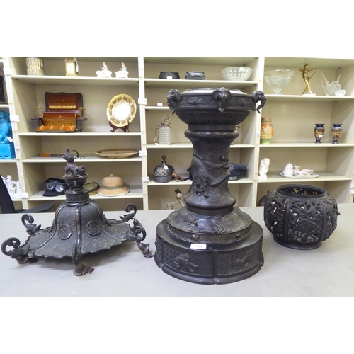 351 - A Japanese bronze finished, metal temple censer with a pagoda top, over a pierced bowl, on a pedesta... 