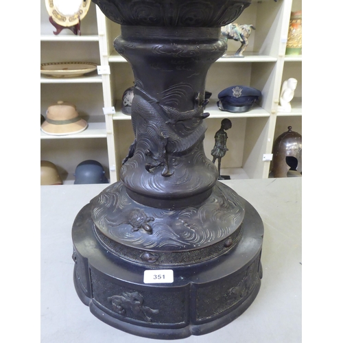 351 - A Japanese bronze finished, metal temple censer with a pagoda top, over a pierced bowl, on a pedesta... 